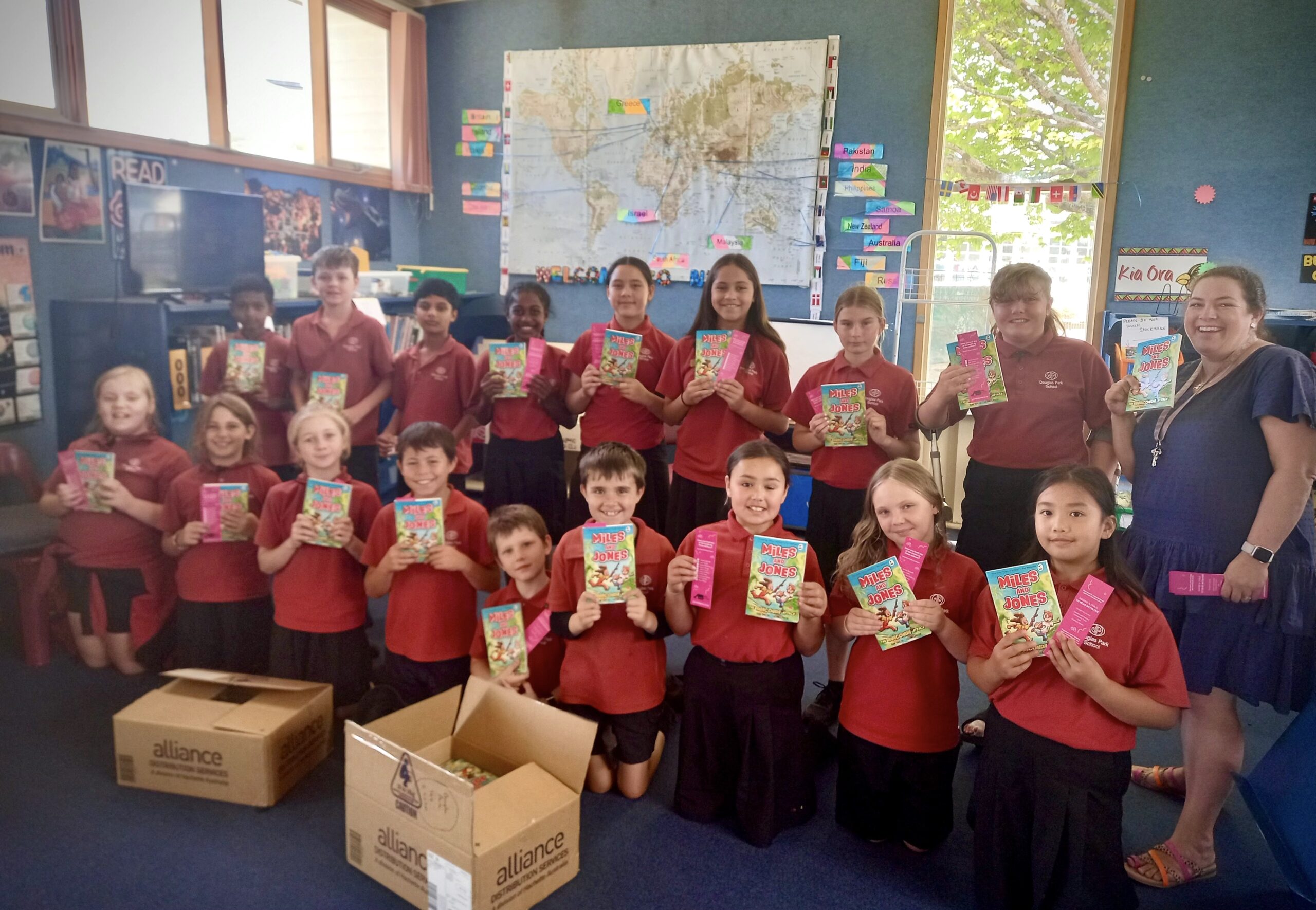 Douglas Park School kids with free books from Eastern and Central